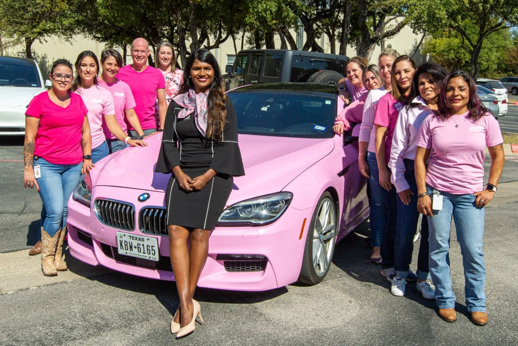 Dr. Arthy Saravanan w pink car and ARA staff