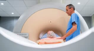 An MRI technician administers a prostate MRI to a male patient