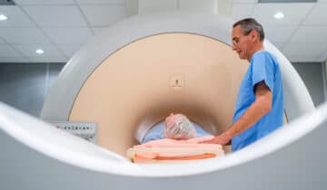 An MRI technician administers a prostate MRI to a male patient