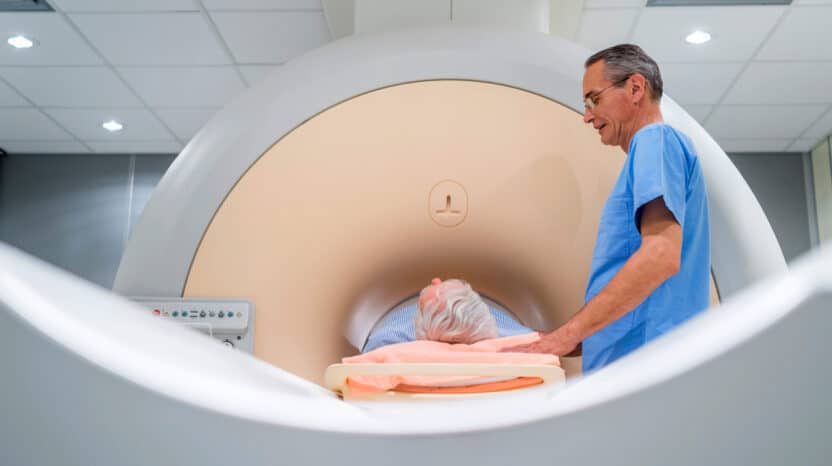 An MRI technician administers a prostate MRI to a male patient