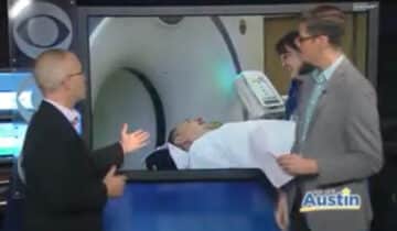 Video screen capture of a radiologist explaining the use of a PET/CT scan in nuclear medicine diagnostic procedure.